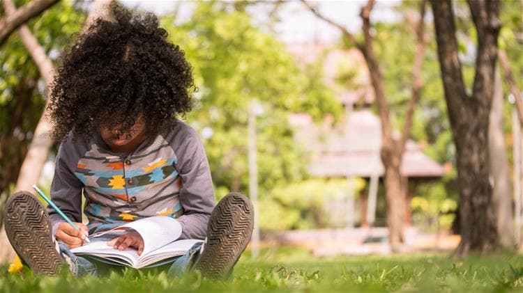 unsized_elementary_boy_outside_reading