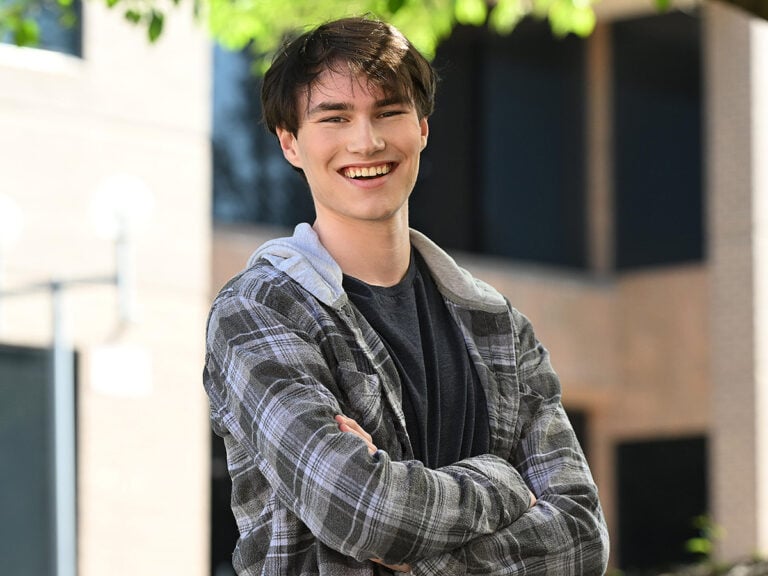 Portrait of smiling teen boy outside
