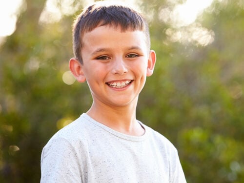 Portrait of a smiling white boy looking to camera